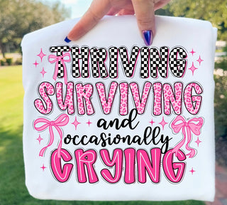 THRIVING SURVIVING AND OCCASIONALLY CRYING